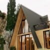 Villa A-Frame Ikonik Minimalis: Desain Fasad Kaca Penuh dengan Atap Metal Tegas